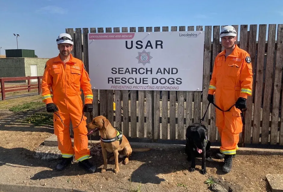 Ryan and specialist search and rescue dog Max (right) have gone to Turkey to assist in the search for survivors. Pictured here with a canine specialist colleague and his dog Delta