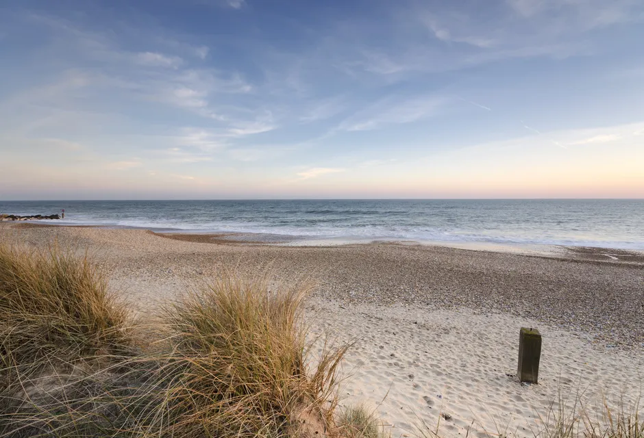 View of an sandy beach with the sea beyond