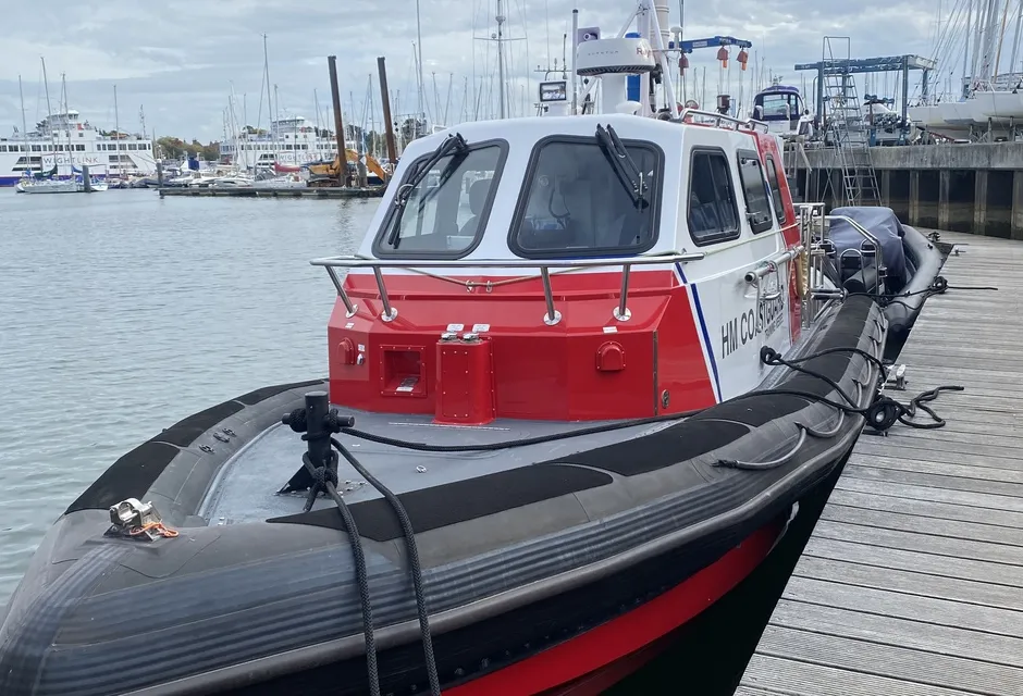 An HM Coastguard training vessel moored up