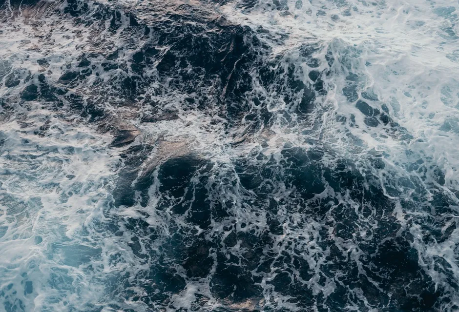 An aerial view of water in choppy conditions.