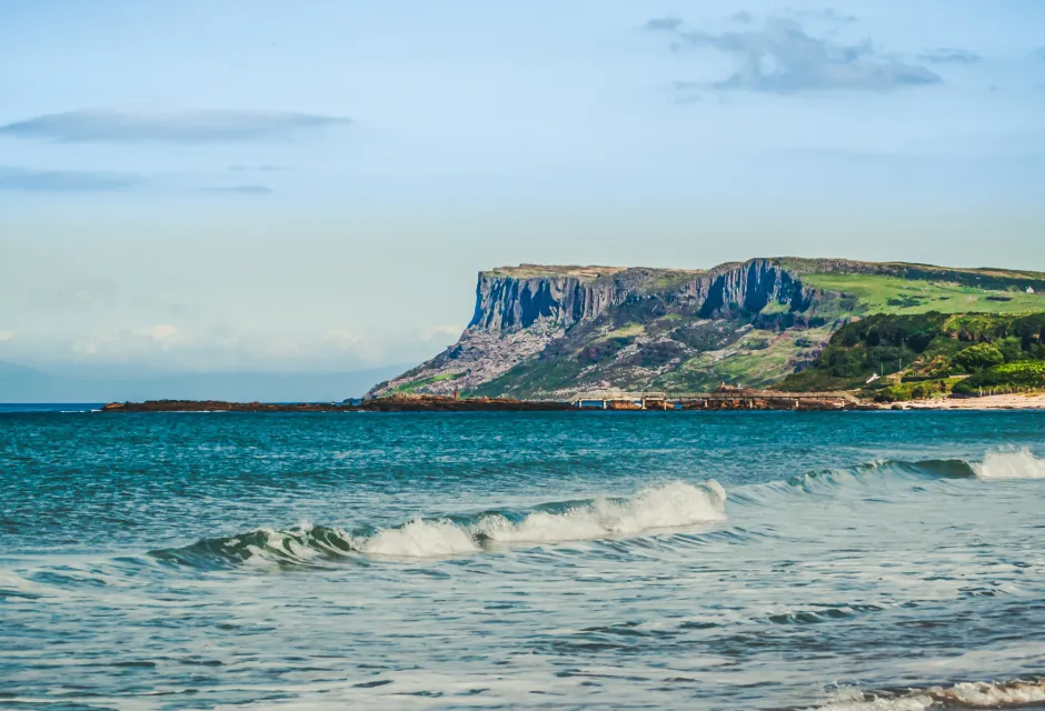 The North Coast of Northern Ireland from Ballycastle Beach in Country Antrim. In the background is the coast of Scotland