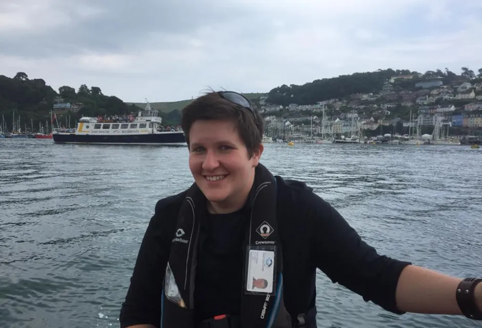Smiling Jayne with large body of water in background and hills in distance