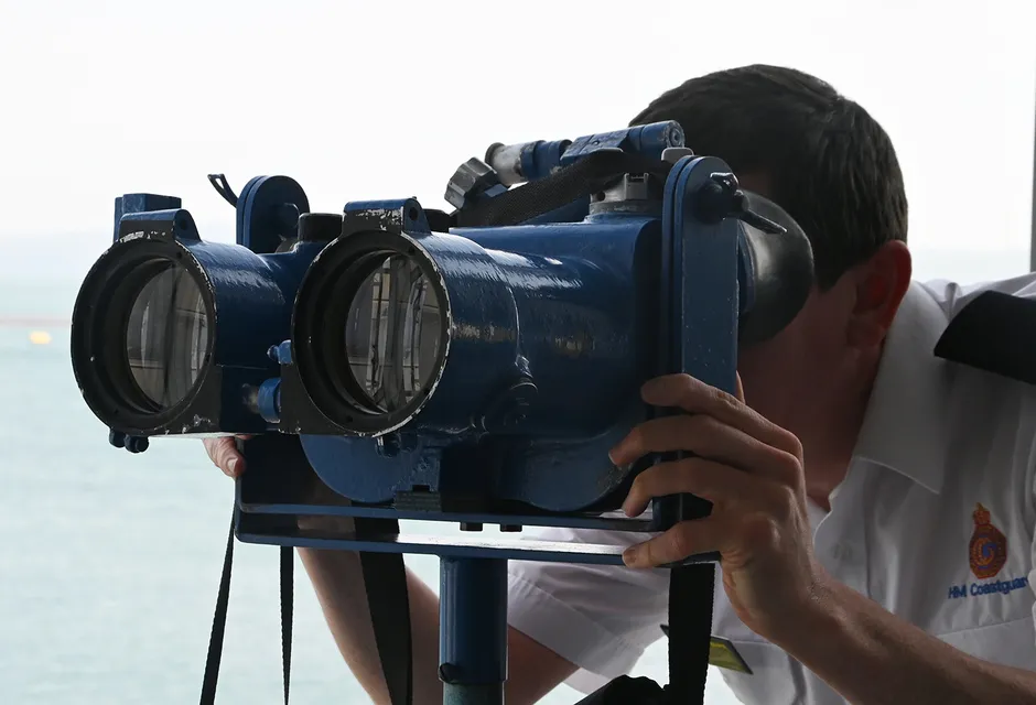 An HM Coastguard officers keeps watch at Holyhead Maritime Rescue Coordination Centre
