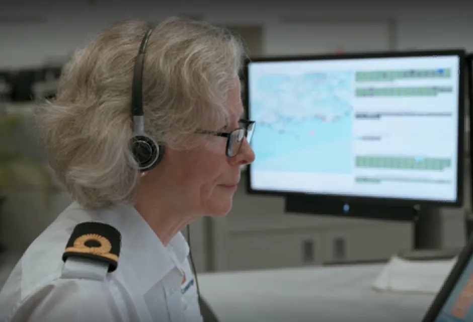 An officer at a computer at the Joint Rescue Coordination Centre in Fareham