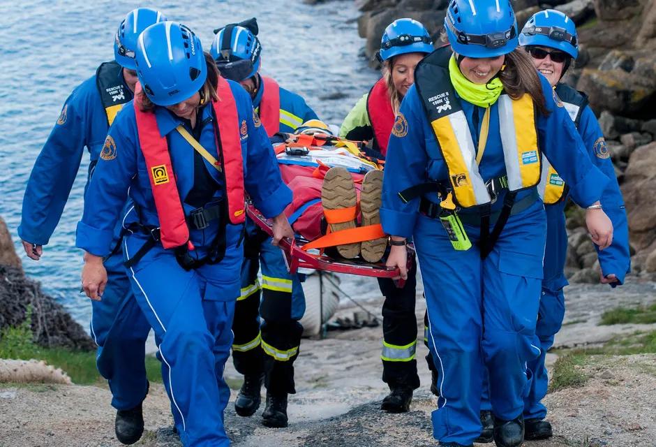 An HM Coastguard Rescue Team extricates a casualty from a coastal location 