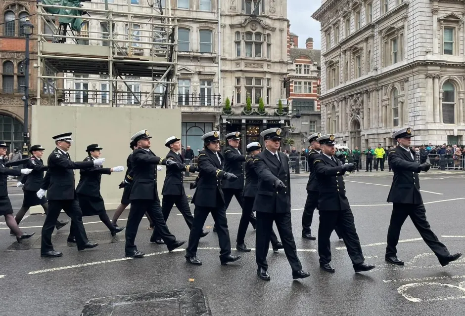Coastguards in formal uniform marching 