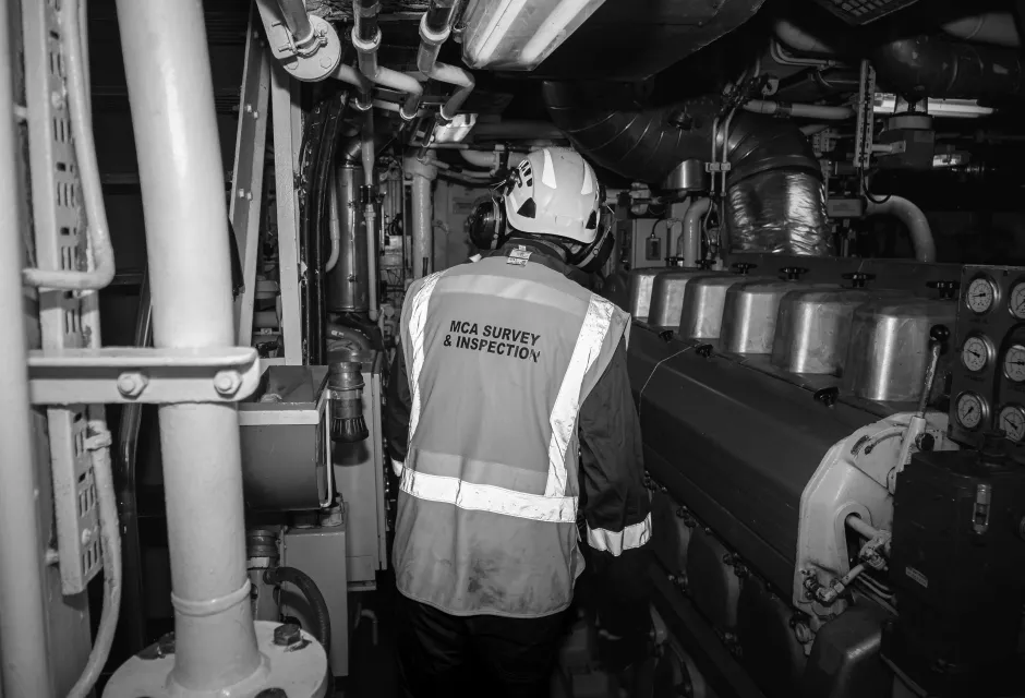 A marine surveyor inspecting a vessel