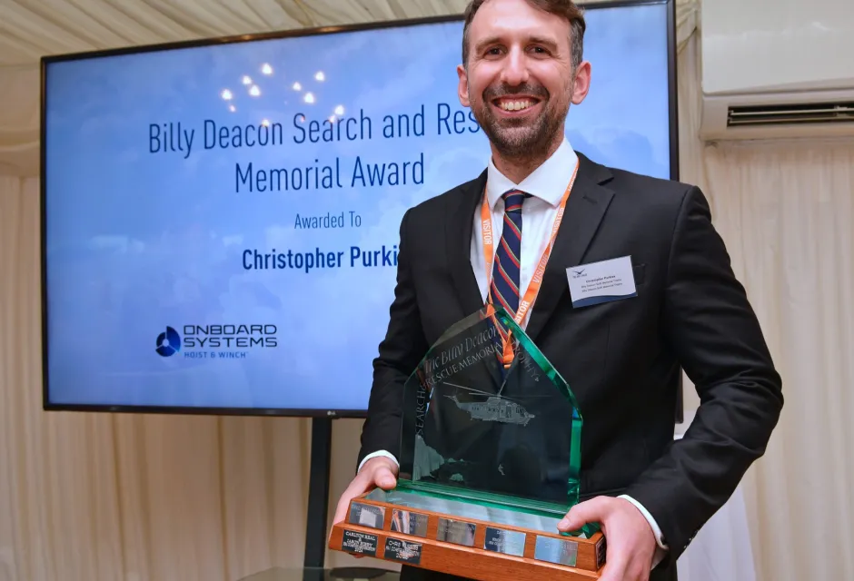 Chris Purkiss, a Winch Paramedic from Lydd’s R163 Coastguard Rescue Helicopter team, received the Billy Deacon SAR Memorial Trophy at the House of Commons as part of the Air League’s Annual Reception Ceremony on 9 July. 