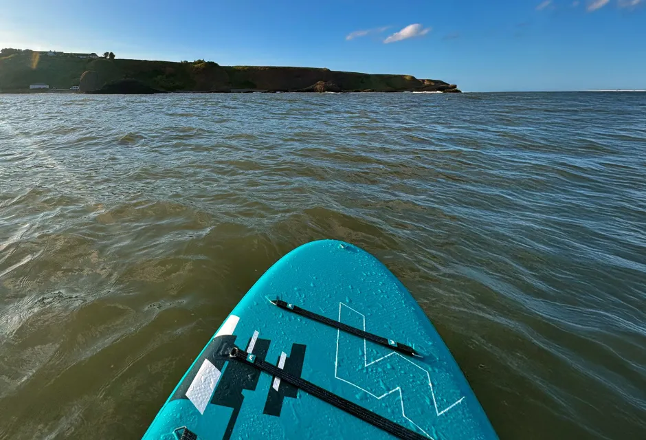 Stand up paddleboarding at Catterline Bay