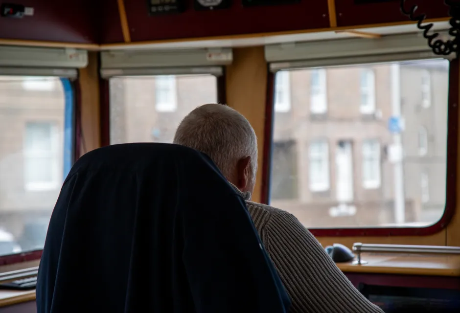 Fishing skipper Bruce Mitchell looks out the windows of his vessel